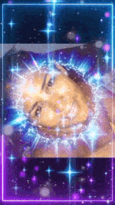 a woman laying on a bed with purple and blue lights surrounding her face