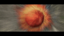 a blurry picture of a red and yellow explosion