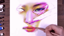 a person is painting a woman 's face with a brush .