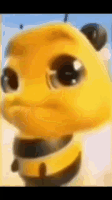 a close up of a yellow cartoon character 's face