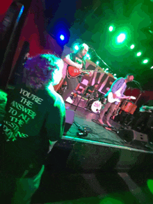 a man in a shirt that says you 're the answer to all the questions