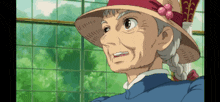 an older woman wearing a straw hat and a blue shirt is looking at something .