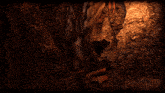 a person laying on a rock in a dark room with a snake in the background