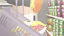 a person is putting a bag of chips into a shopping basket with a price tag of 5 cents