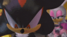 shadow the hedgehog and rouge the bat are standing next to each other in a cartoon .