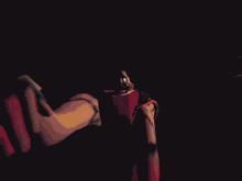 a pixel art drawing of a man in a red robe