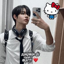 a young man taking a picture of himself in a mirror with the name sungmin de marti on the bottom