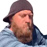 a man with a beard is wearing a black hat