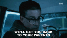 a man wearing glasses says " we 'll get you back to your parents "