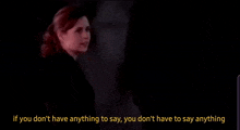 a woman in a dark room with the words if you don 't have anything to say you don 't have to say anything below her