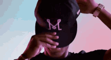 Put On Hat Christian Makoun GIF - Put On Hat Christian Makoun Inter Miami Cf GIFs