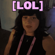 a woman wearing a black tank top and a pink lanyard with the name shagarita on it