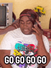 a woman wearing a nyc shirt is talking on the phone