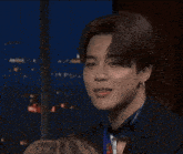 a close up of a man with the words i 'm ~ jimin behind him
