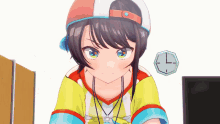 a girl with a hat and a necklace is sitting in front of a computer and a clock