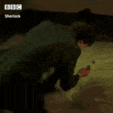 a person is sitting in a bathtub with a fork in their hand and a bbc logo in the corner .