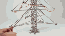 a person is playing with a toy that looks like a power line