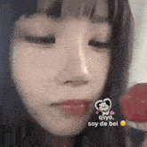 a close up of a girl 's face with a monkey on her face .