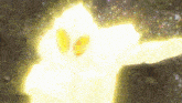 a close up of a person 's face with a glowing yellow light coming out of it .