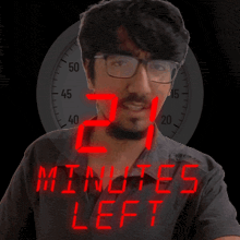 a man in front of a clock with the words minutes left on it