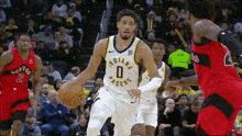 a basketball player for the indiana pacers is dribbling the ball