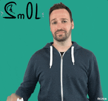 a man in a blue hoodie is giving the middle finger with the word smol below him
