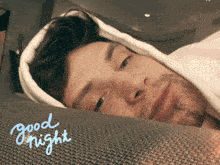 a man laying on a couch with the words " good night " written on the bottom