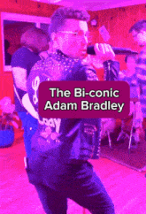 a man singing into a microphone with the bi-conic adam bradley written on the bottom