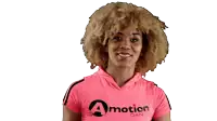 a woman wearing a pink shirt that says " a motion dance "