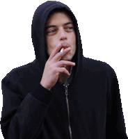 a man in a hoodie smoking a cigarette