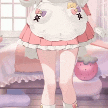 a girl in a pink skirt is standing in a room with a strawberry on the floor .