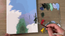 a person is painting on a canvas with the words made in animotica visible