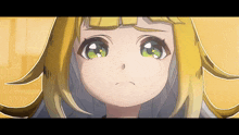 a close up of a girl 's face with green eyes
