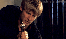 a gif of a man smoking a cigarette with the hashtag @irreverentgifs at the bottom