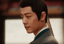 a close up of a man 's face and neck
