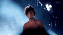 a shirtless man with a tattoo on his chest that says xiii and xiii
