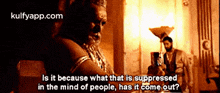 a man is sitting at a table and talking about what is suppressed in the mind of people has it come out ?