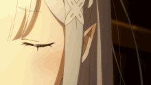 a close up of a girl 's face with her eyes closed and a star in her eye