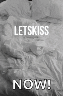 a black and white photo of a bed with the words letskiss now written on it
