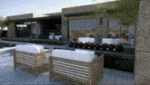 an artist 's impression of a house with a fire pit in the backyard