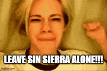 a woman is crying and saying leave sin sierra alone !!!