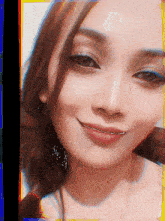 a woman with braces on her teeth is smiling
