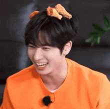 a young man with chicken nuggets on his head
