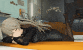 a girl in a black dress laying on a bed with her legs crossed