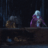 a woman in a yellow dress is walking on a dark stage