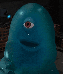 a blue blob with a red eye and a smile on its face