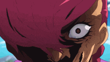 a close up of a cartoon character 's face with a large eye .