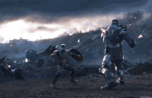 captain america and thanos are fighting in a battle scene