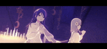 a couple of anime girls are standing next to each other