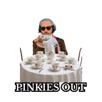 a man sitting at a table with cups and saucers and the words pinkies out behind him